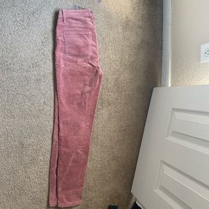 Salmon colored skinny and stretchy corduroy pants